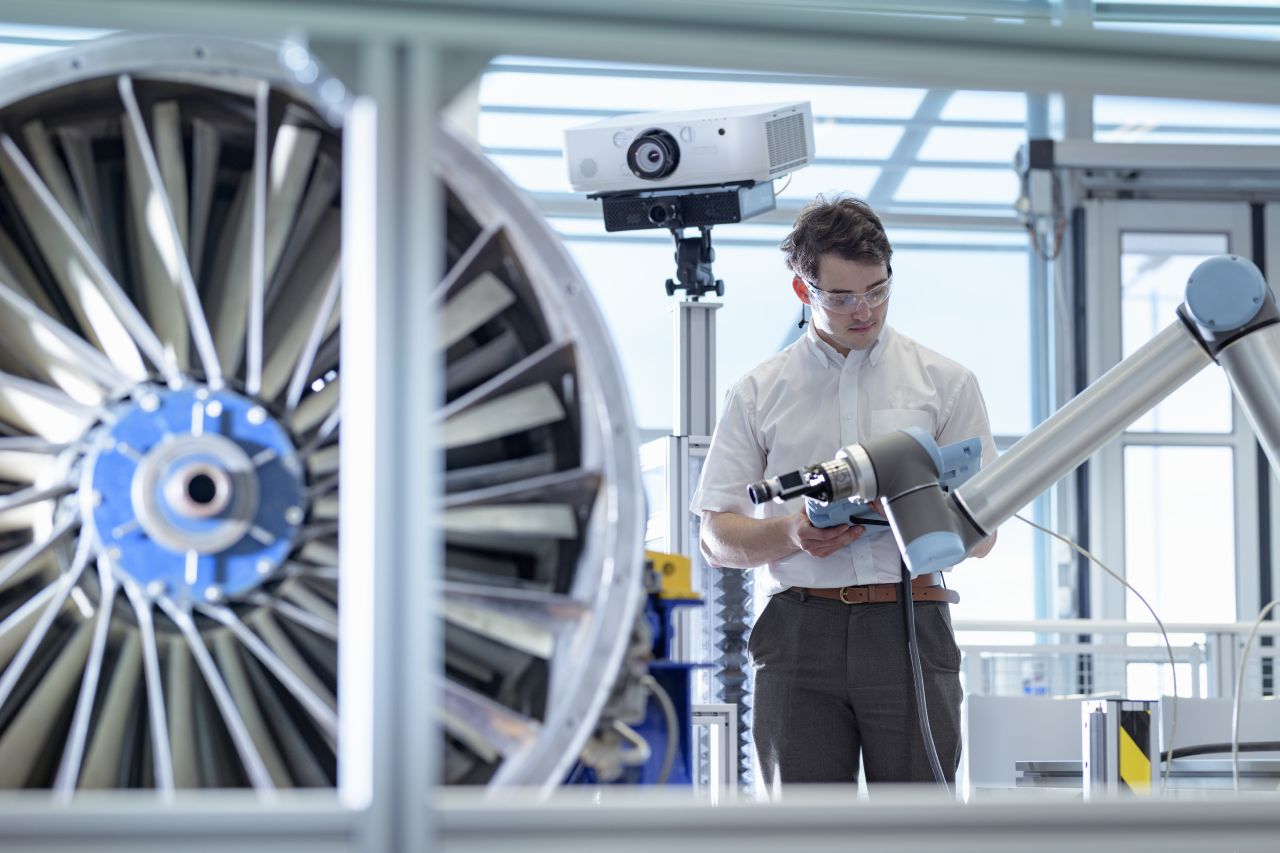 engineer-using-robotic-metrology-to-measure-jet-en-2023-11-27-05-15-23-utcsmal